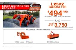 Kubota L2502 tractor with LA526 loader and BB1566 box blade shown in worksite material handling package