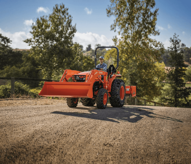 Tractor driving down the road