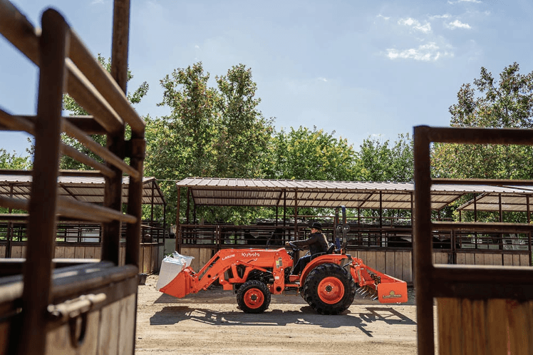 L3902 riding through a stable