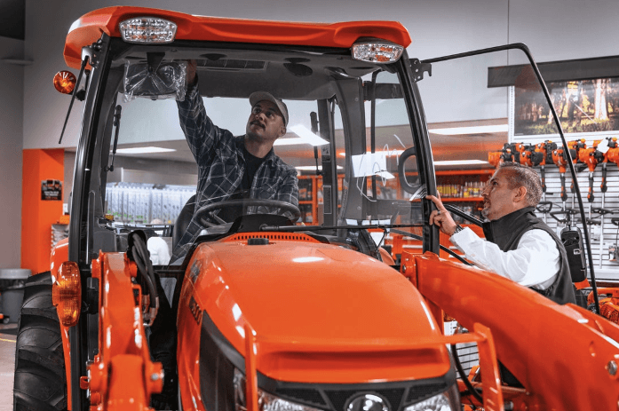 Man looking at tractor