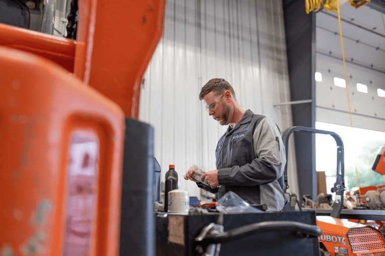 Kubota technician working on equipment