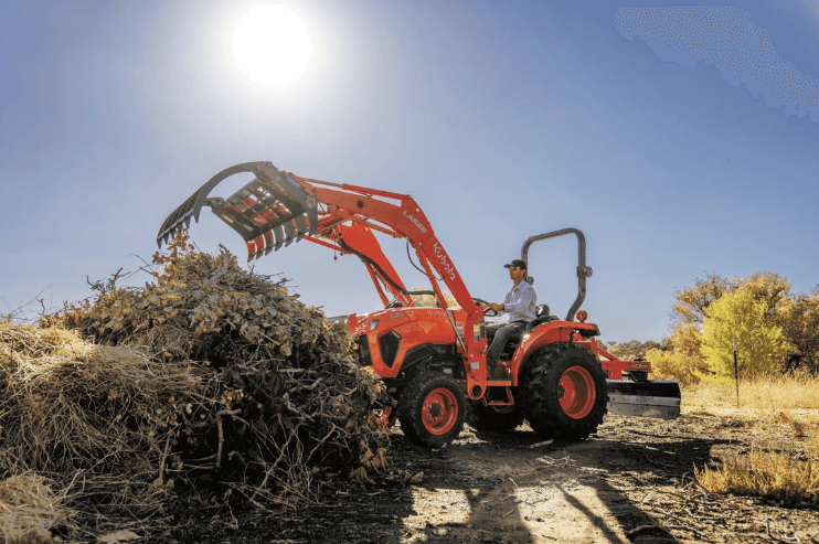 Tractor clearing out debris