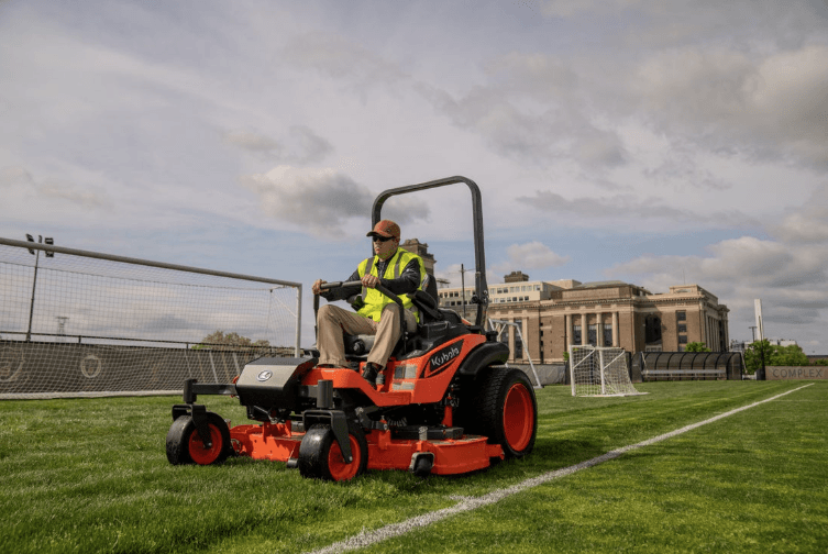 Man mowing a soccer field 