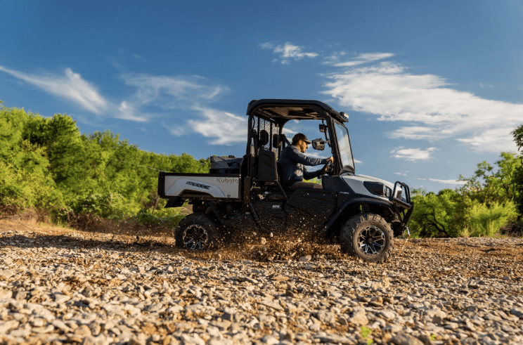 Man driving RTV on a rocky road