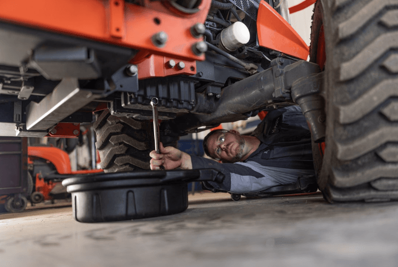 A technician serving the equipment
