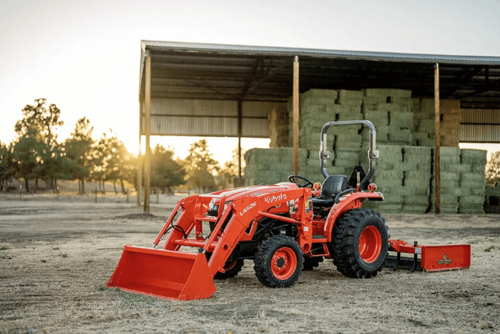 Tractor outside of a barn
