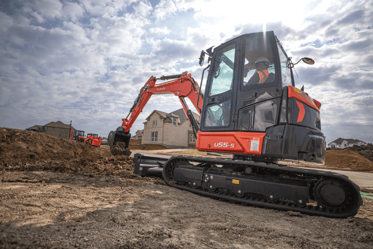 man working on excavator