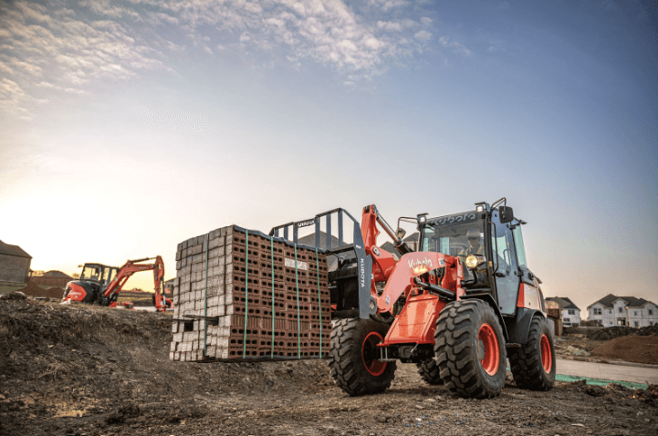 Wheel loader moving pallet of bricks