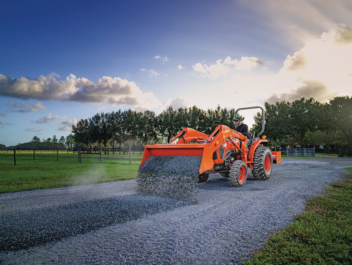 L2502 model laying down gravel on drive way